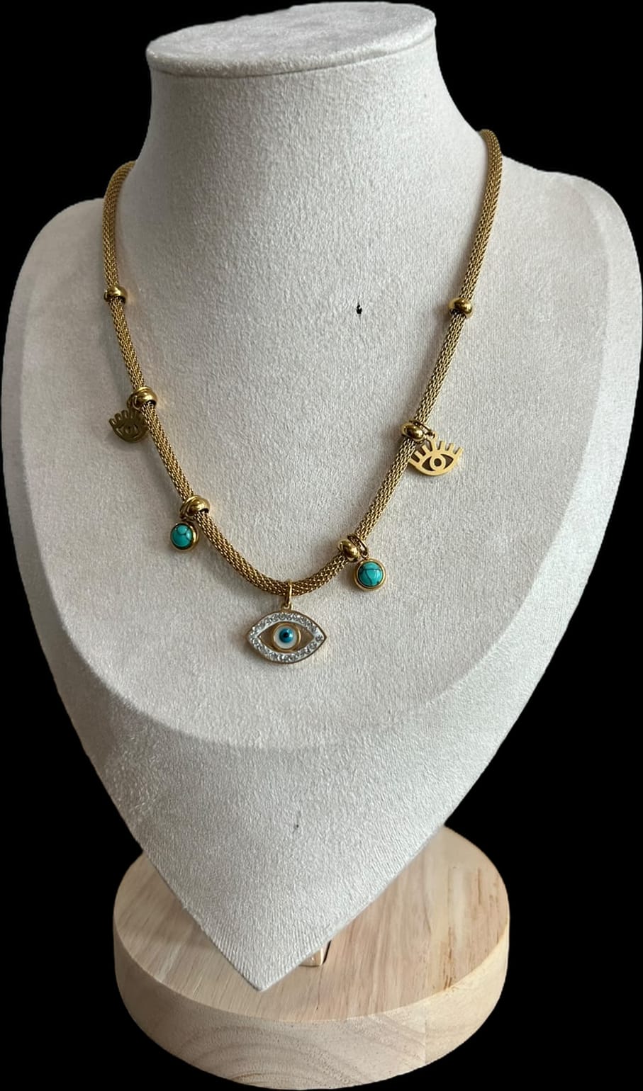 Gargantilla con bolitas y ojos turcos.oro