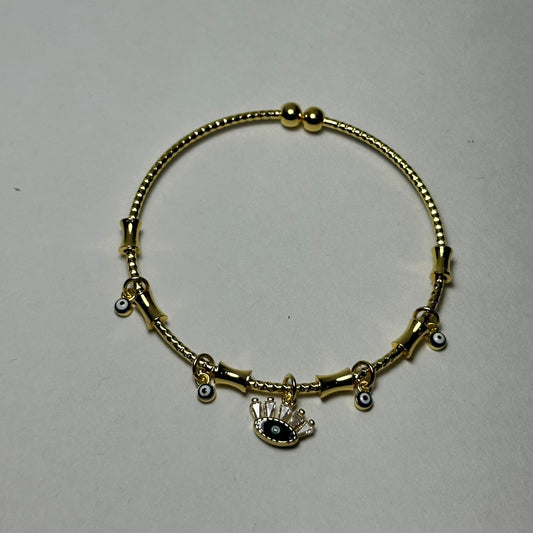 Pulsera abierta ojo en medio azul marino.oro