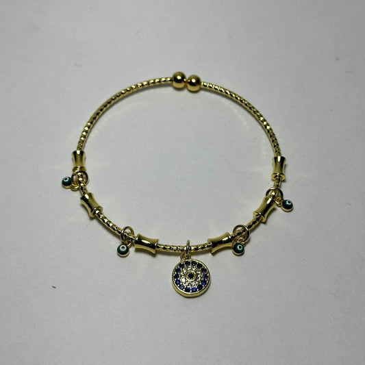 Pulsera abierta ojo redondo azul marino en medio.oro