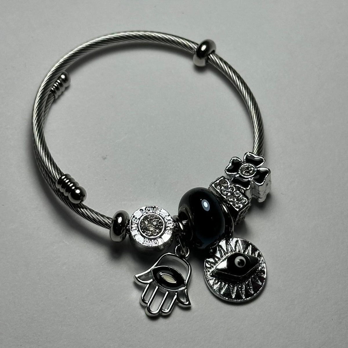 Pulsera abierta varios diges negro.plata