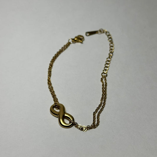 Pulsera doble con infinito liso en medio.oro