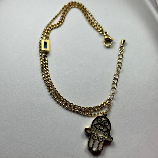 Pulsera doble con mano color blanca.oro