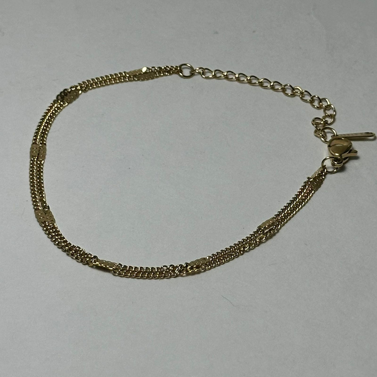 Pulsera doble con rectángulos.oro