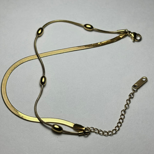 Pulsera doble plana y bolitas.oro