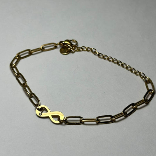 Pulsera eslabón ancho, infinito en medio-una piedra.oro