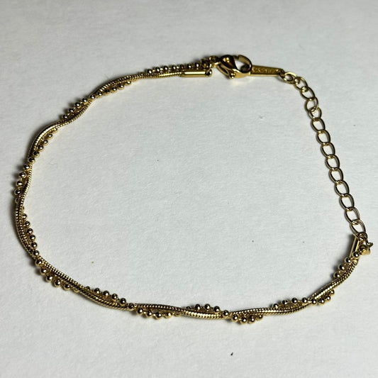 Pulsera torcida, doble con bolitas.oro