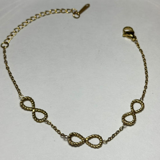 pulsera tres infinitos,torsal.oro