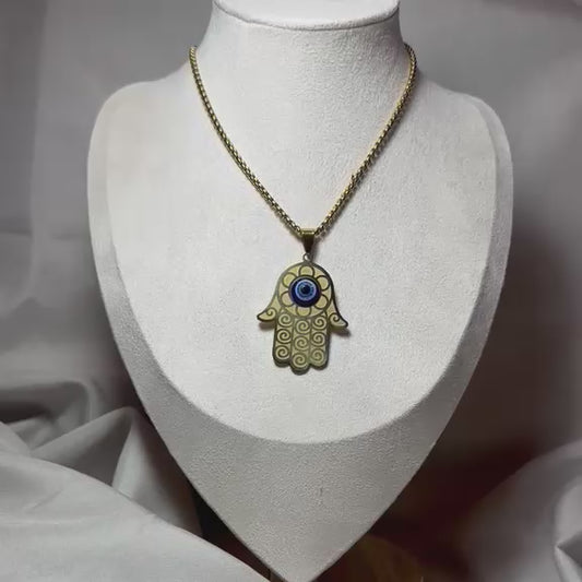 Collar mano con ojo.oro